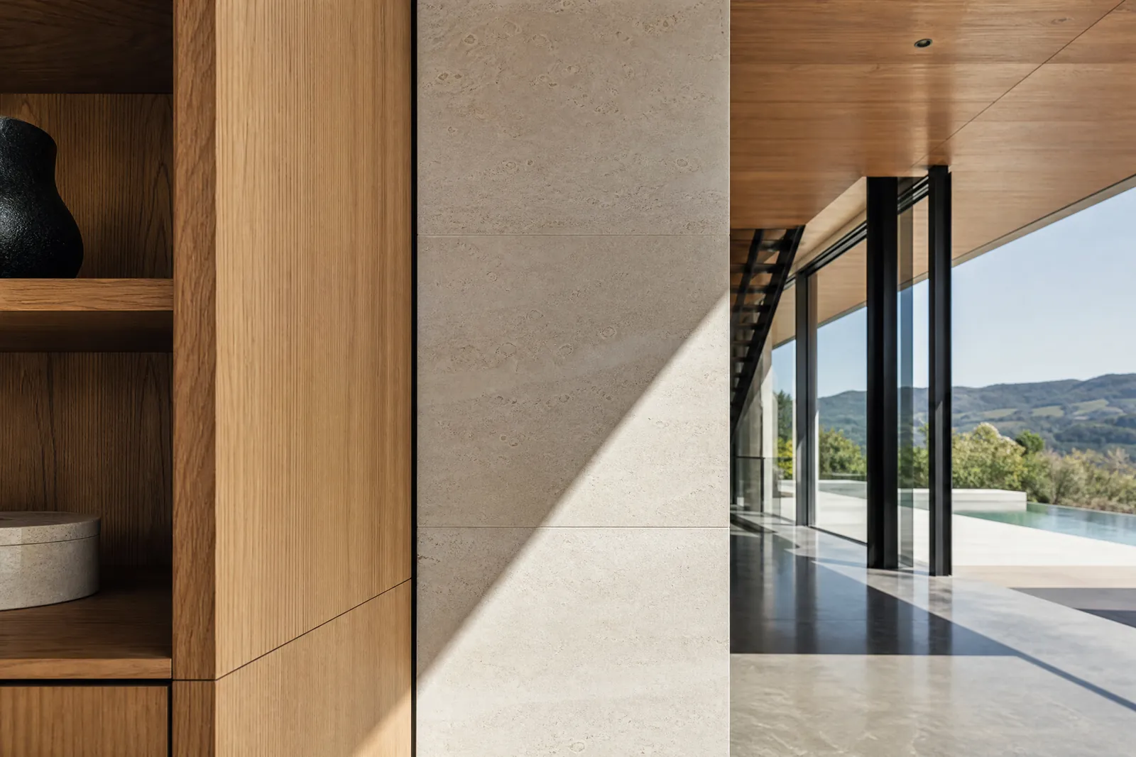 A precise architectural detail where two surfaces meet at a fine shadow gap.