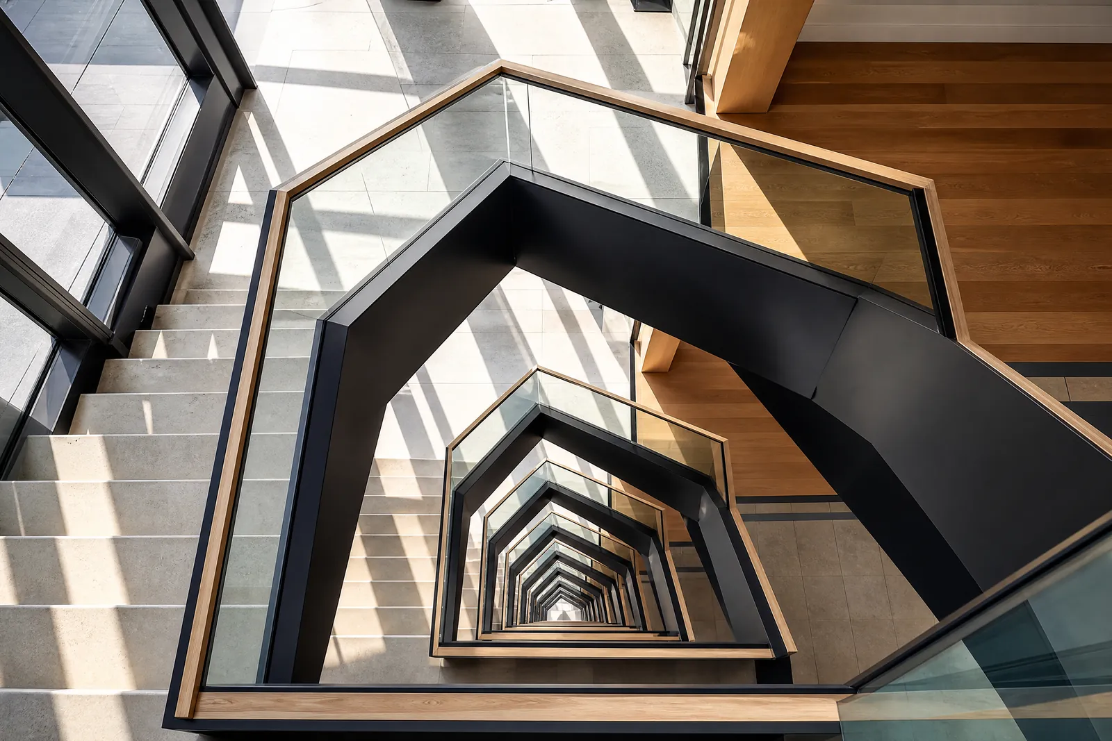 A modern building stair core seen from directly above.
